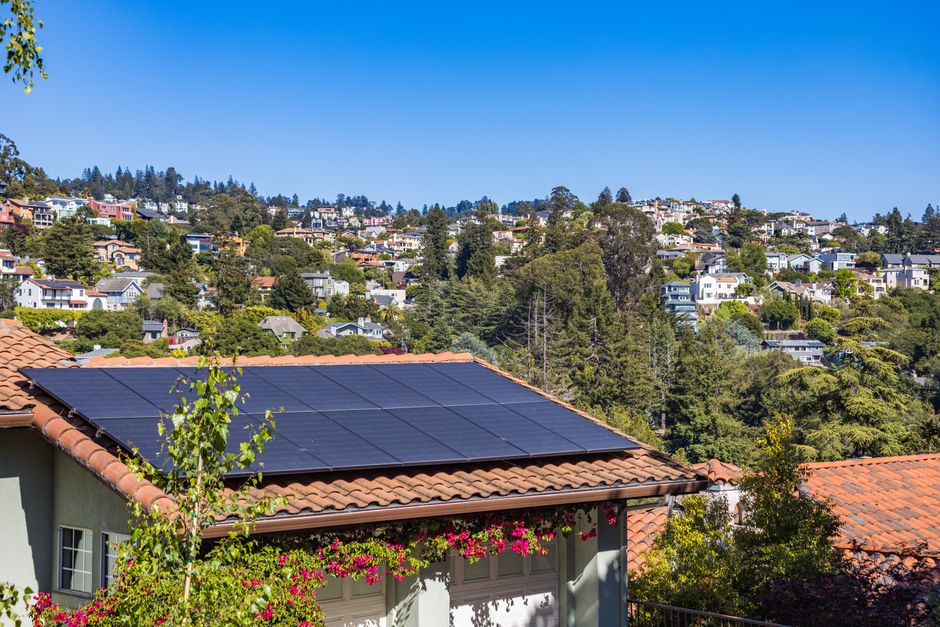 Beautiful house roof fitted with modern solar panels